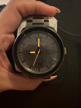 Nixon Black Dial Stainless Steel Watch with Yellow Hands no battery